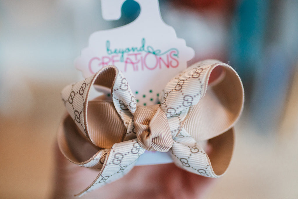 Layered Medium Bow **Gucci